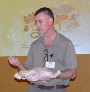 Ron Wulff demonstrated the need for an infant training manikin.